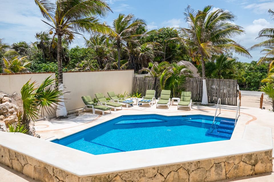 Pool at entrance of  Villa Cascadas Akumal - Oceanfront Villa in Akumal Vacation rental