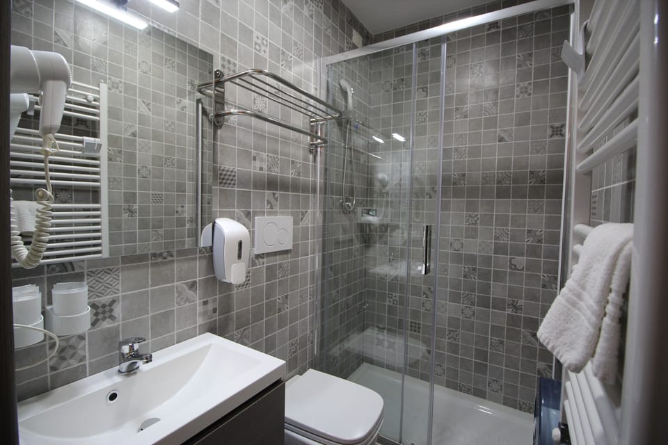 Shower, free toiletries, hair dryer, slippers