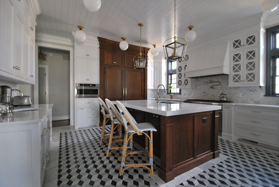 Incredible custom kitchen with commercial grade appliances, marble mosaic floor, quartzite counters and walnut island.