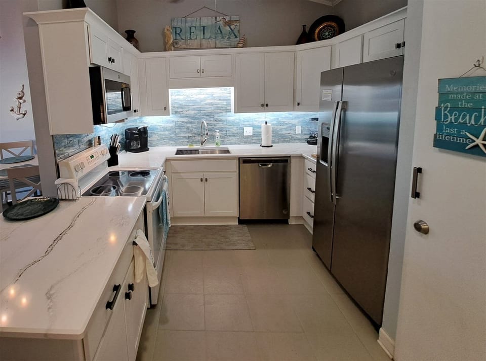 Brand new kitchen cabinets with quartz countertops and sea-glass