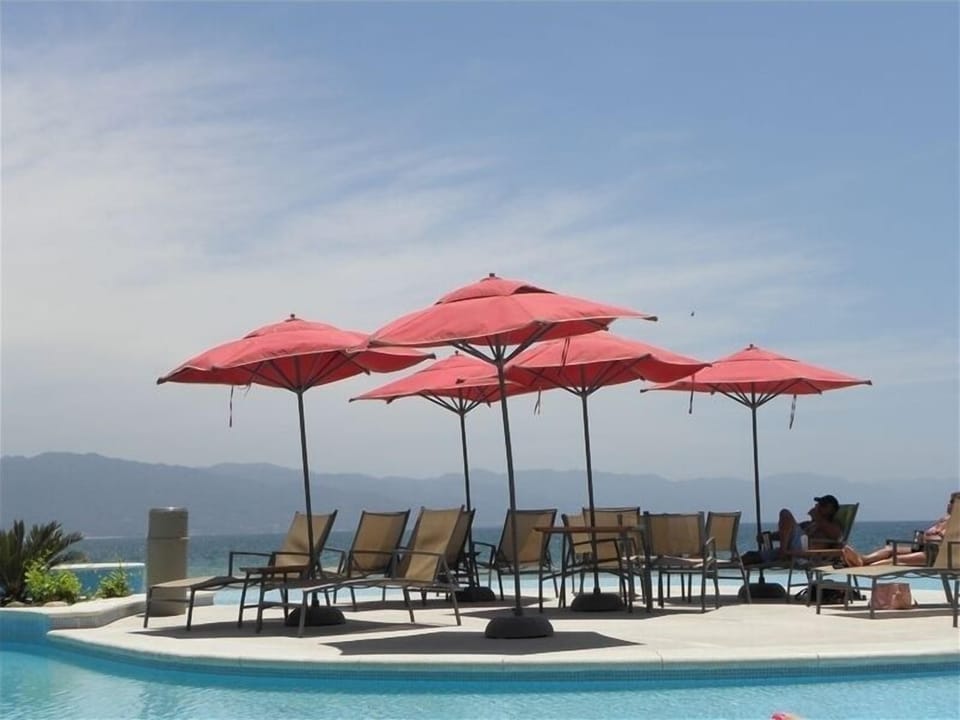 ONE OF THE MANY POOLS WITH SURROUNDING OCEAN AND MOUNTAINS 