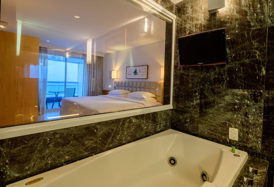 Executive Suite, Sea View | Bathroom | Hair dryer, towels, soap, shampoo