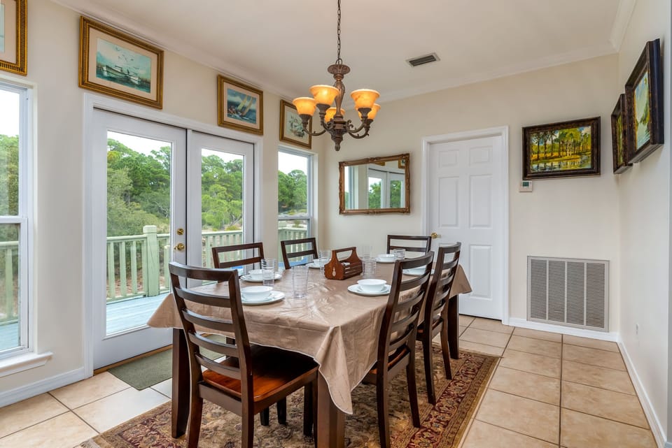 Your dining space awaits with natural lighting and peaceful views, perfect for memorable meals together.