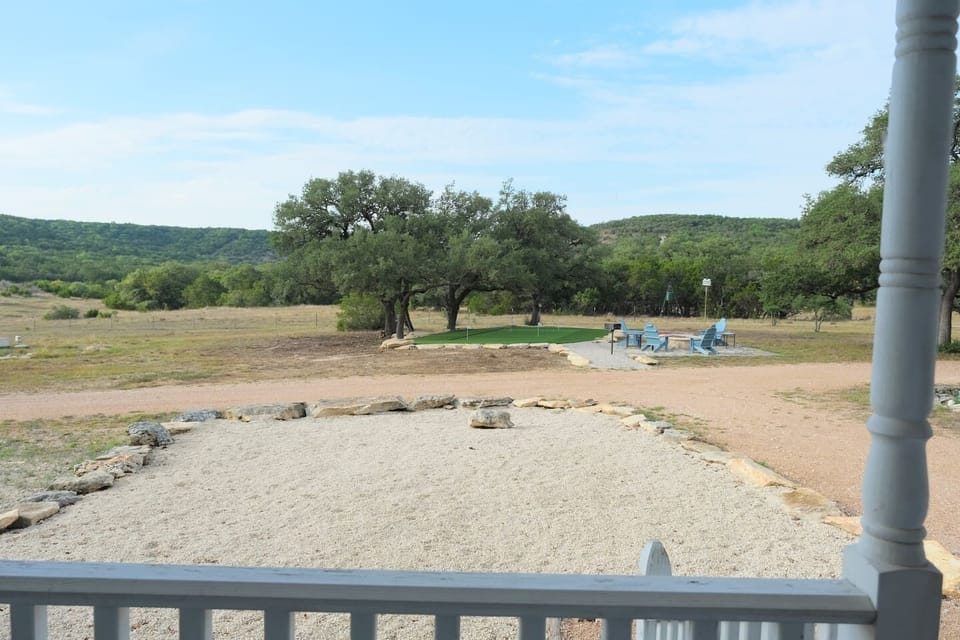 The fire pit, BBQ grill, and putting green are conveniently located across from Cottage #3, Shabby Chic