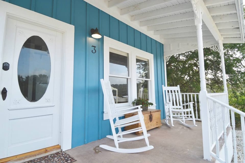 Shabby Chic Cottage, one of 4 at Cottages at Canyon Peaks. Rockers on the front porch are great for sipping coffee in the morning or having a glass of wine at night.  
