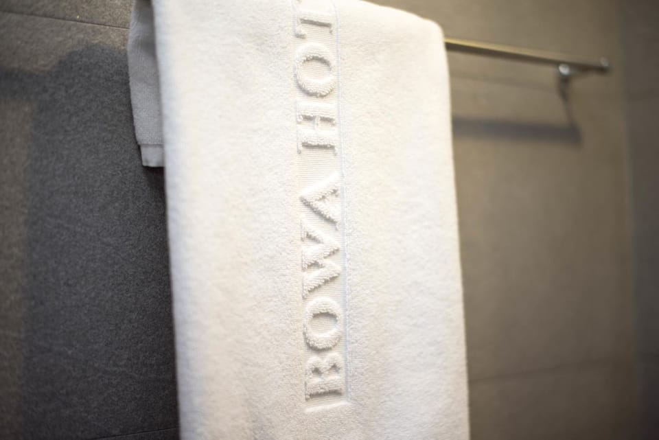 Shower, hair dryer, towels, shampoo