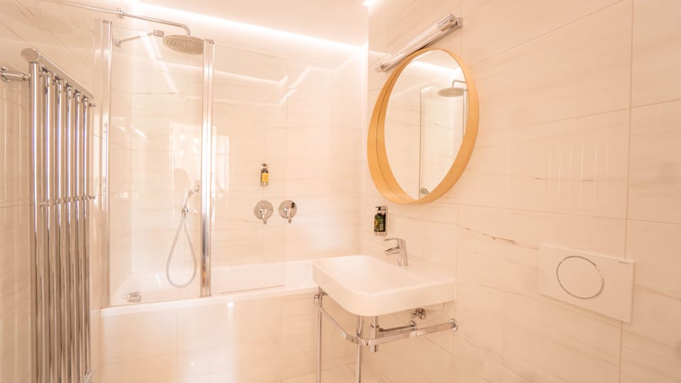 Designer toiletries, hair dryer, bathrobes, slippers