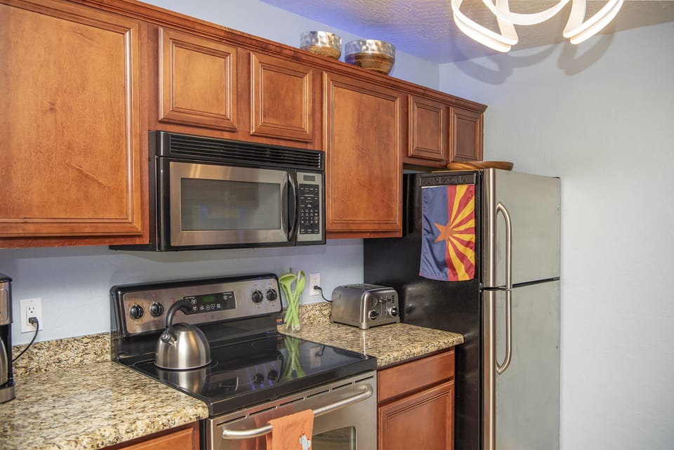 Kitchen with dishwasher, stove, oven, fridge/freezer, ice maker & microwave