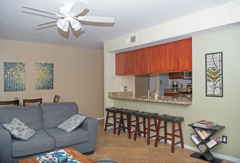 The living room opens to the kitchen, with counter seating for four.