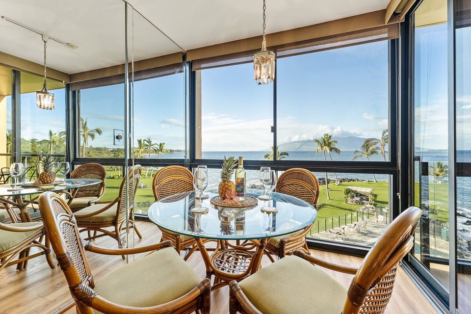 Dining area with floor to ceiling windows.