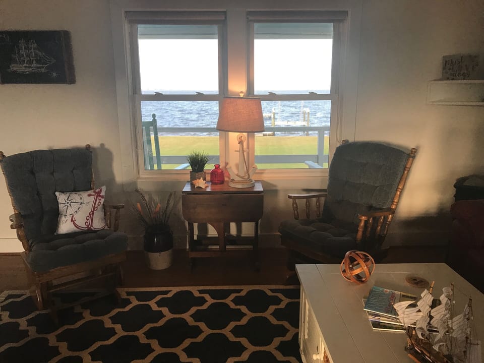 Living room.Includes 2 gliders, 2 recliners & couch with recliners on each end.
