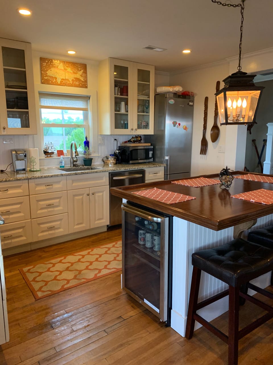 Kitchen with large wooden island. Seats 4. Refrigerator and 2nd small fridge.