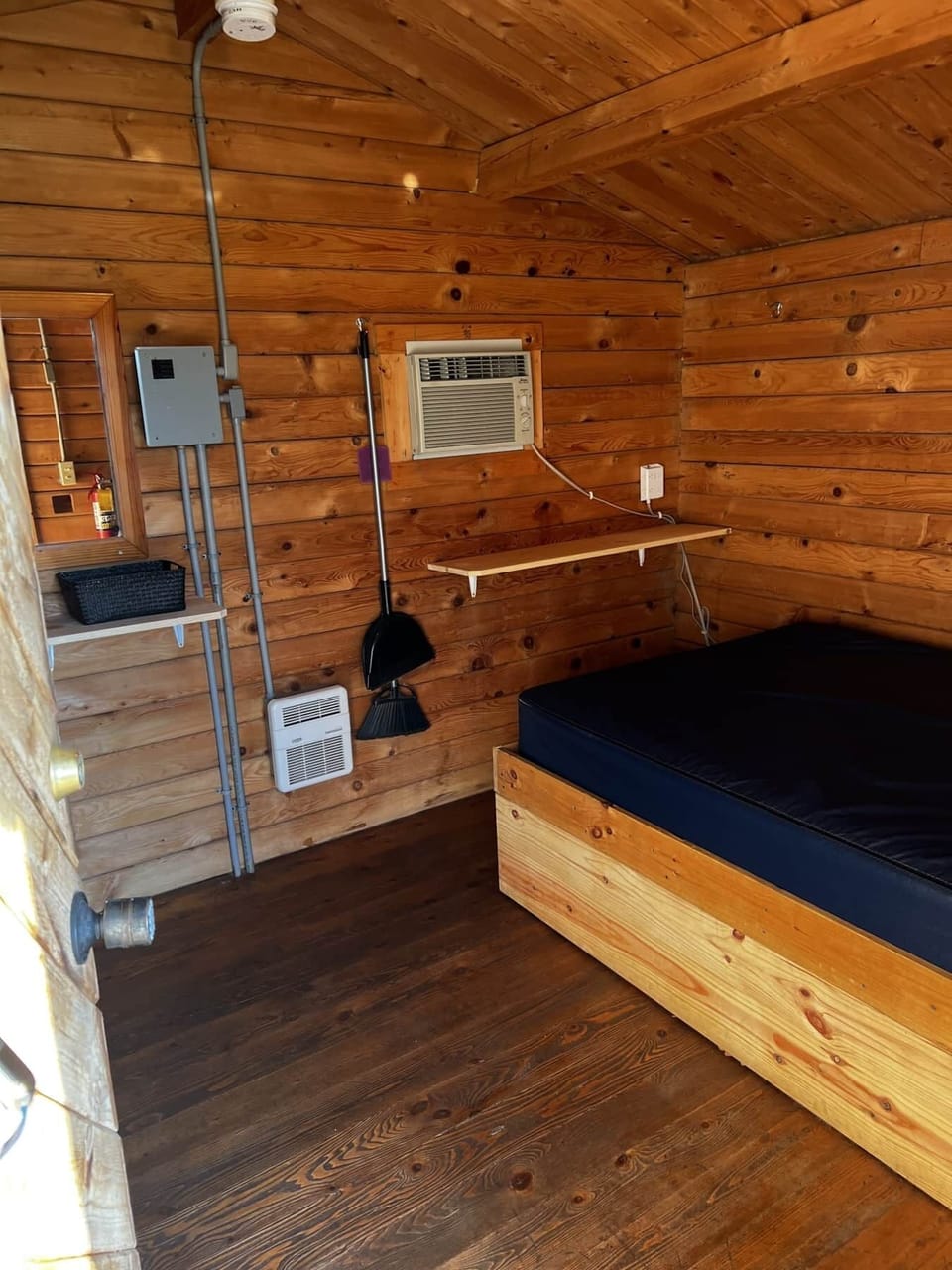 A simple platformed full size bed and twin bunk bed. 