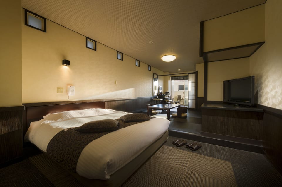 Japanese Western Style Room with Private Open-air Bath, Ocean View | Down comforters, in-room safe, free WiFi, bed sheets