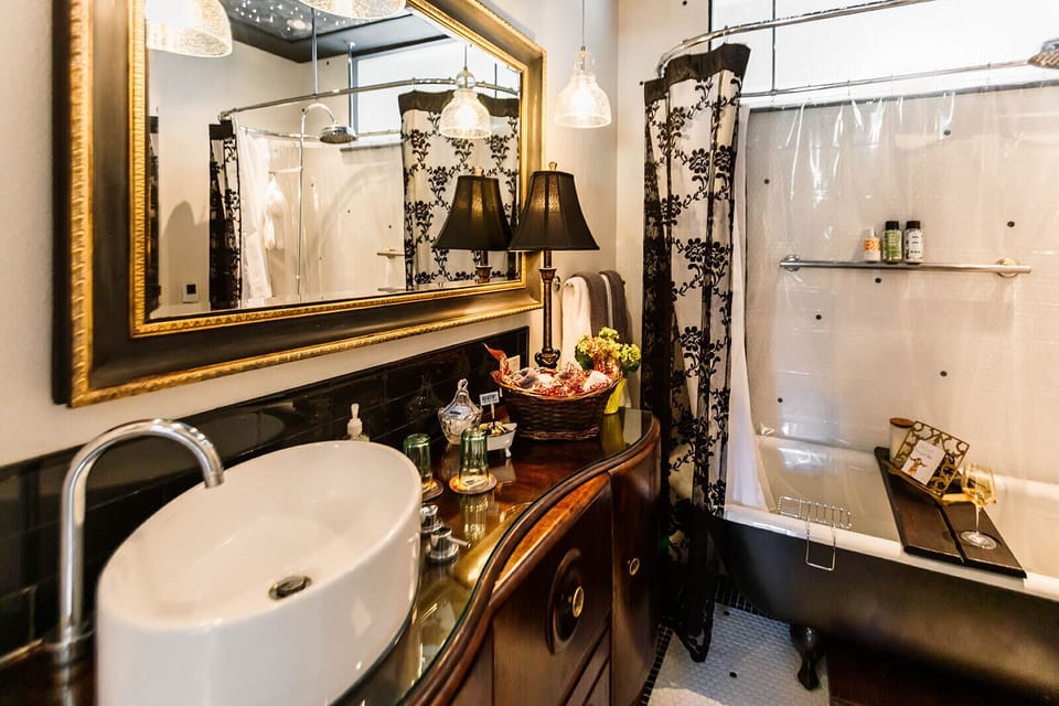 Main floor water closet. Antique bar as a washing station adds functional allure