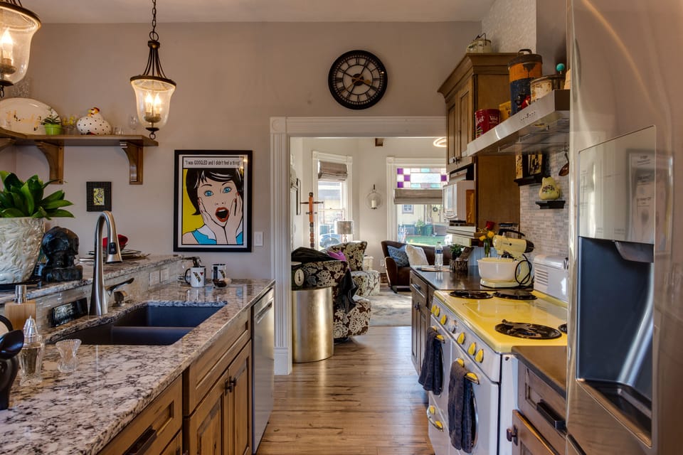 Plenty of common space between the kitchen & living room to mingle together