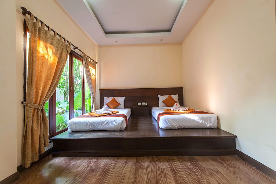 Deluxe Bungalow, Garden View | Minibar, in-room safe, desk, free WiFi