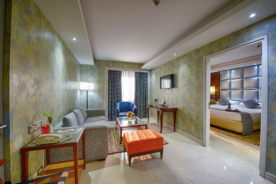 Suite | Premium bedding, down comforters, memory foam beds, in-room safe