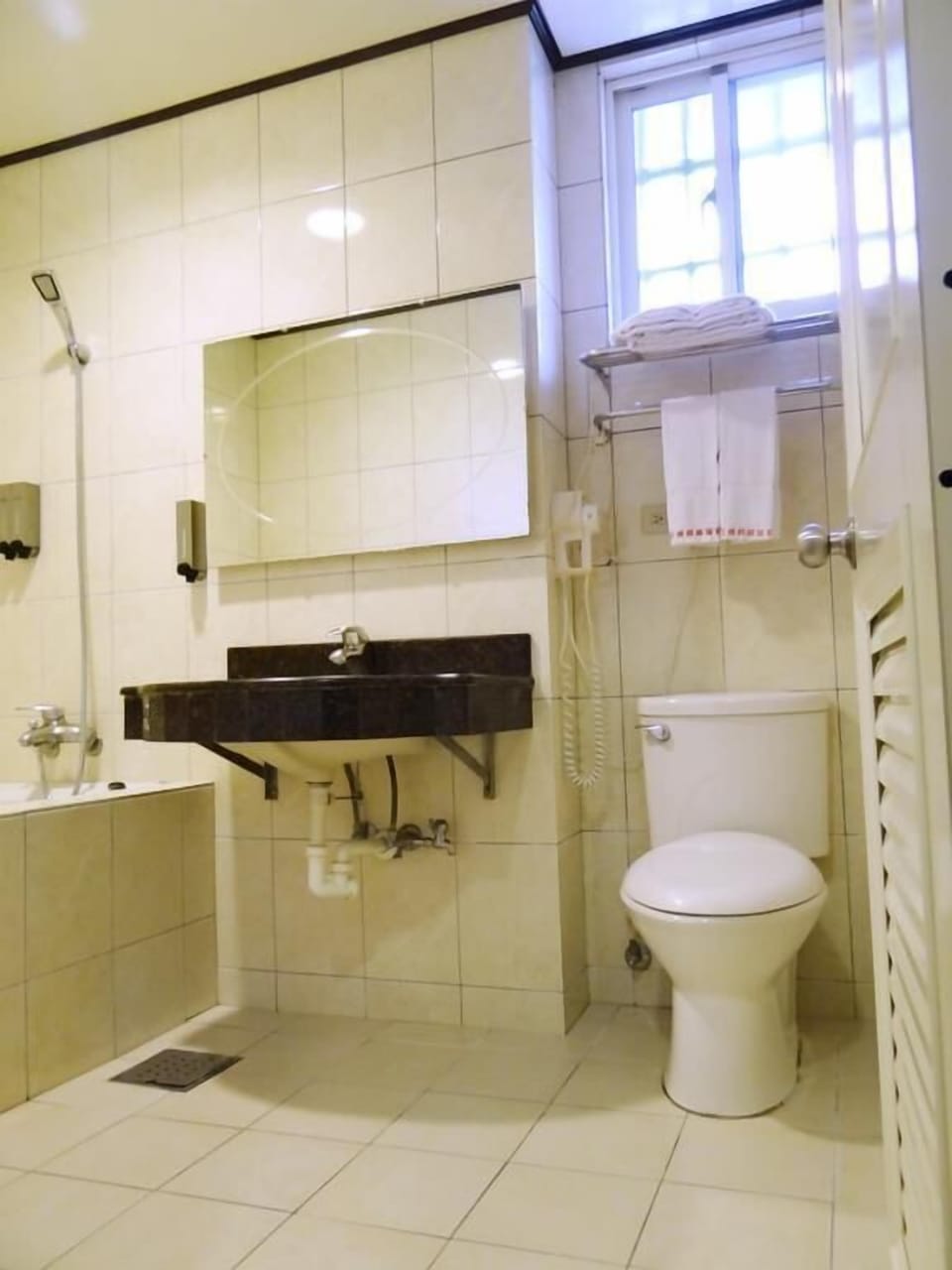 Shower, free toiletries, hair dryer, slippers