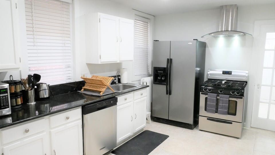 A great kitchen with pantry items and plenty of appliances.