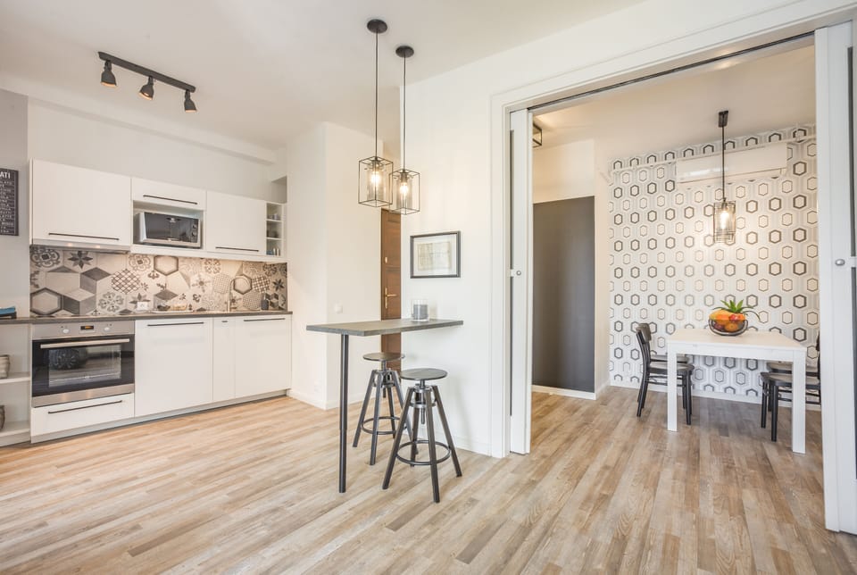 Kitchen and dining table on the right