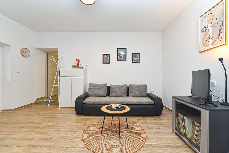 Standard Apartment, 1 Queen Bed with Sofa bed (0360) | Living area | TV