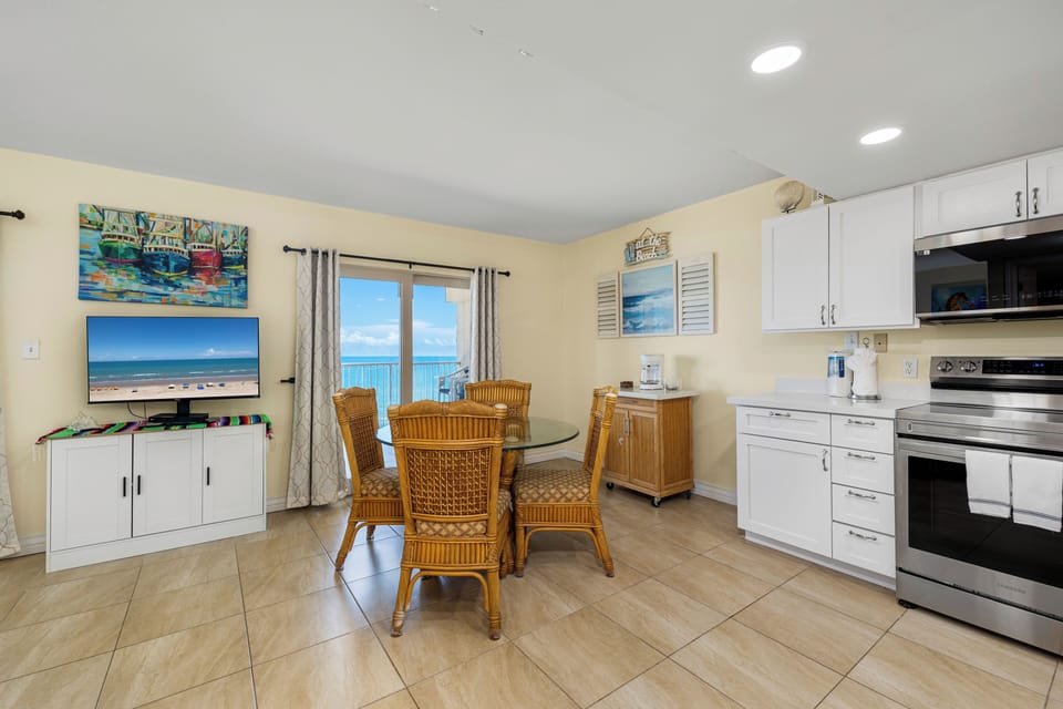 Enjoy preparing meals in the fully equipped kitchen and gathering around the dining table after a day in the sun.