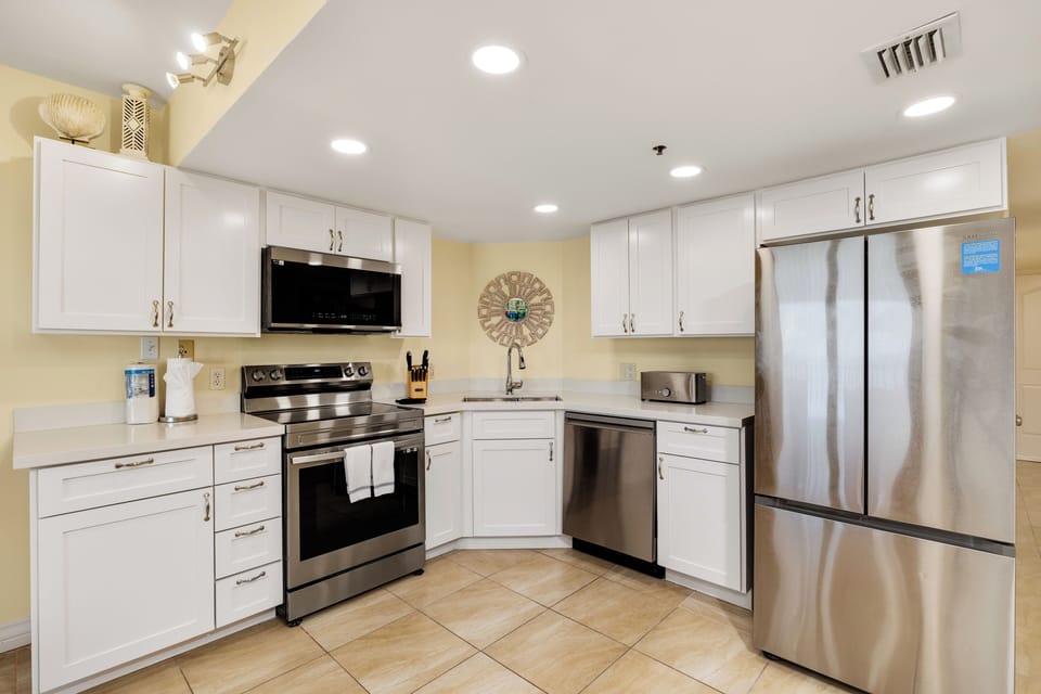 Bright, fully equipped kitchen with stainless steel appliances and plenty of space to prepare your favorite vacation meals.