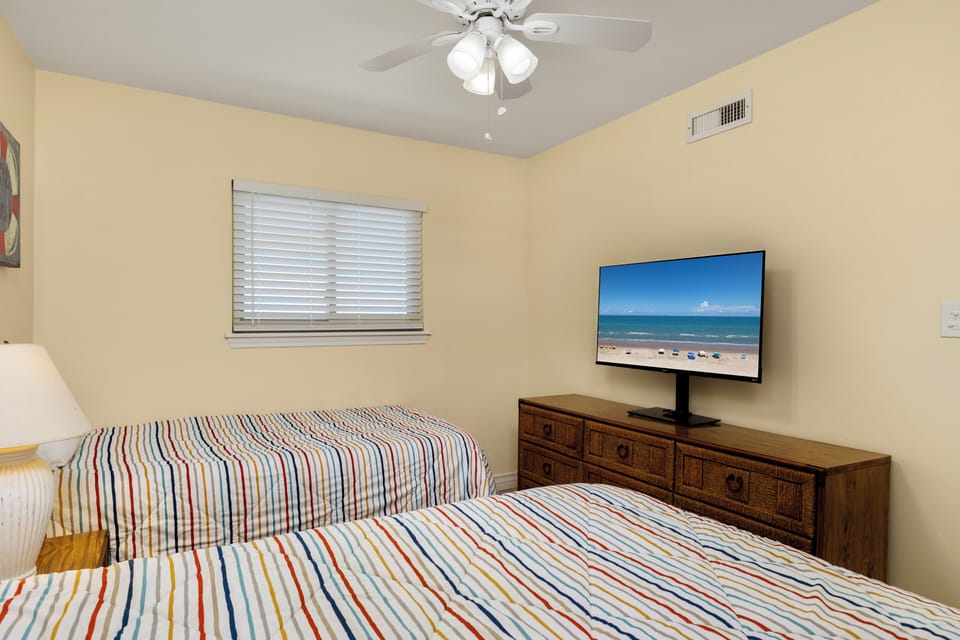 Relax and wind down in the guest bedroom with its own flat screen TV.