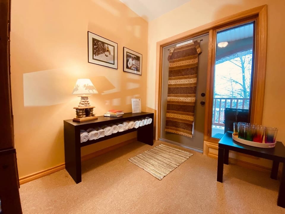 The Queen/Bunk room leads out onto the lower level Hot Tub deck.