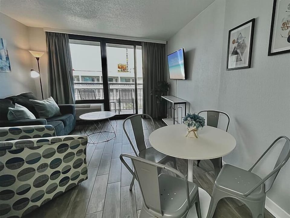 Indulge in beachfront bliss in our suite. Boasting a comfortable couch in the living area, providing the ultimate coastal comfort.