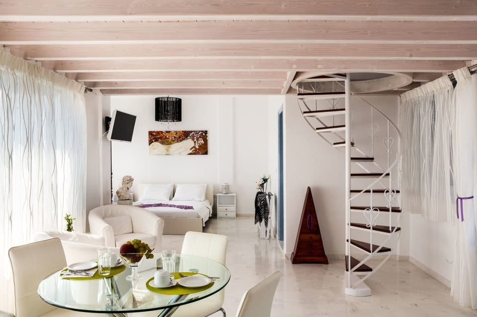 Honeymoon Studio Suite, Jetted Tub, Sea View | Living area | Flat-screen TV