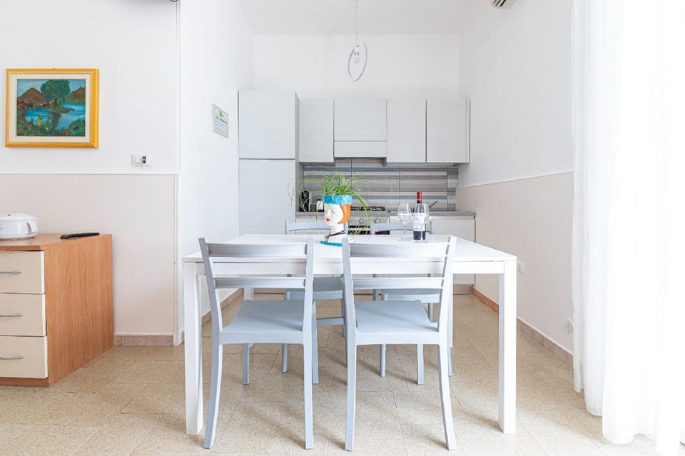 Comfort Apartment, 1 Bedroom, Patio | Living area | 32-inch flat-screen TV with digital channels