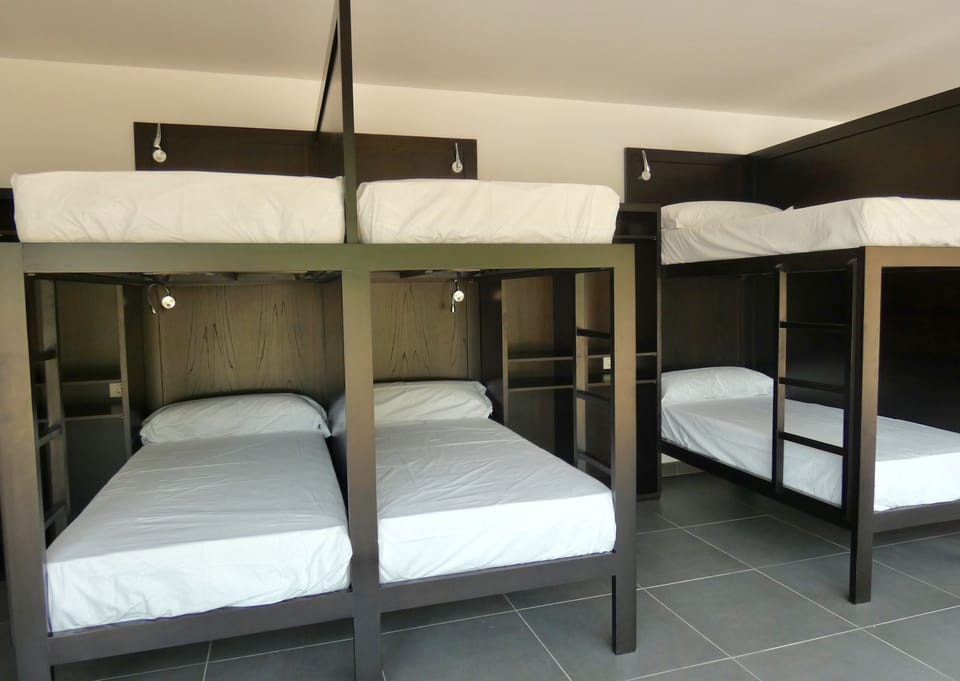 Shared Dormitory, Mixed Dorm, Shared Bathroom (1 bed in a 14-Bed Mixed Dorm Room) | Down comforters, in-room safe, soundproofing, rollaway beds