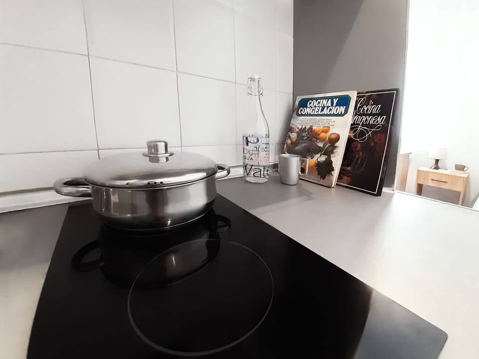 Full-size fridge, microwave, stovetop, cookware/dishes/utensils
