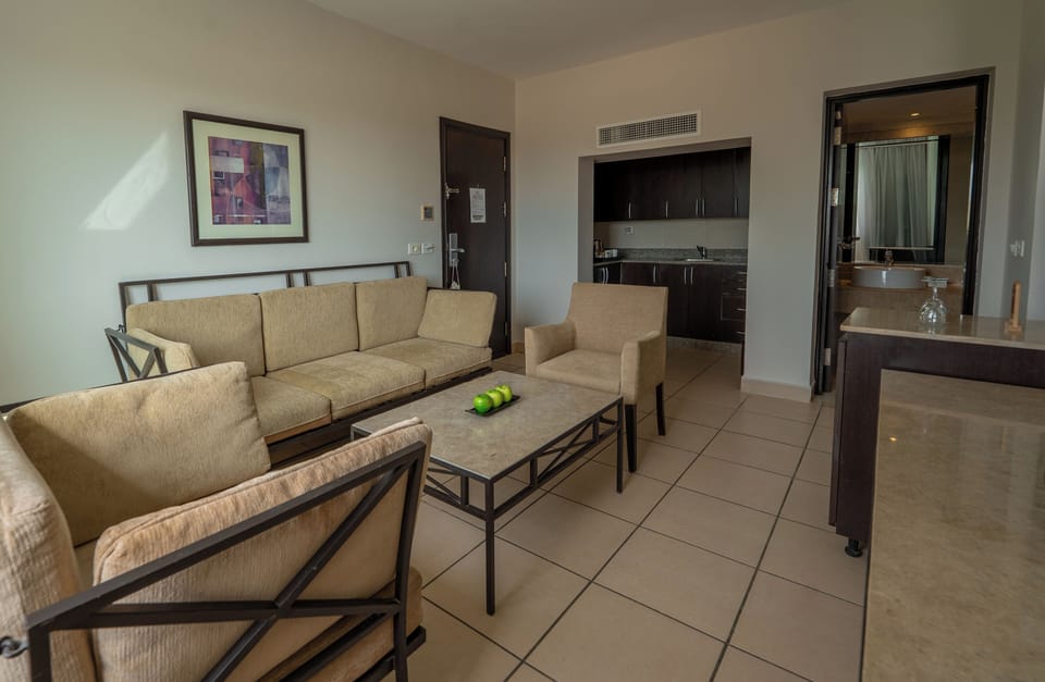 Family, Queen Bed, Garden View | Living room | 26-inch TV with satellite channels