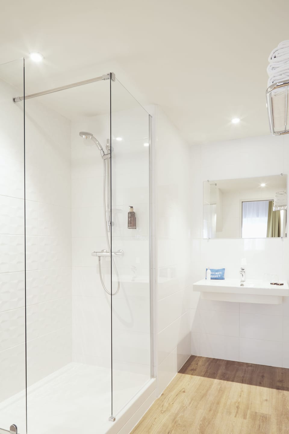 Shower, eco-friendly toiletries, hair dryer, towels