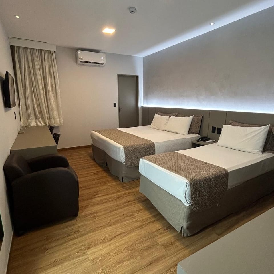 Deluxe Triple Room | Minibar, in-room safe, blackout drapes, free WiFi