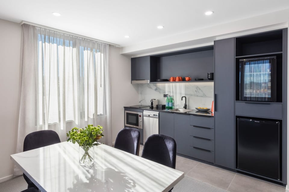 Two Bedroom Apartment Suite | Living area | 55-inch LCD TV with digital channels, TV, pay movies