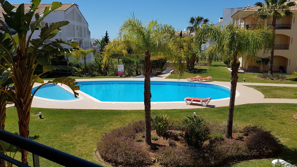 View of the Pool and lawns from balcony.