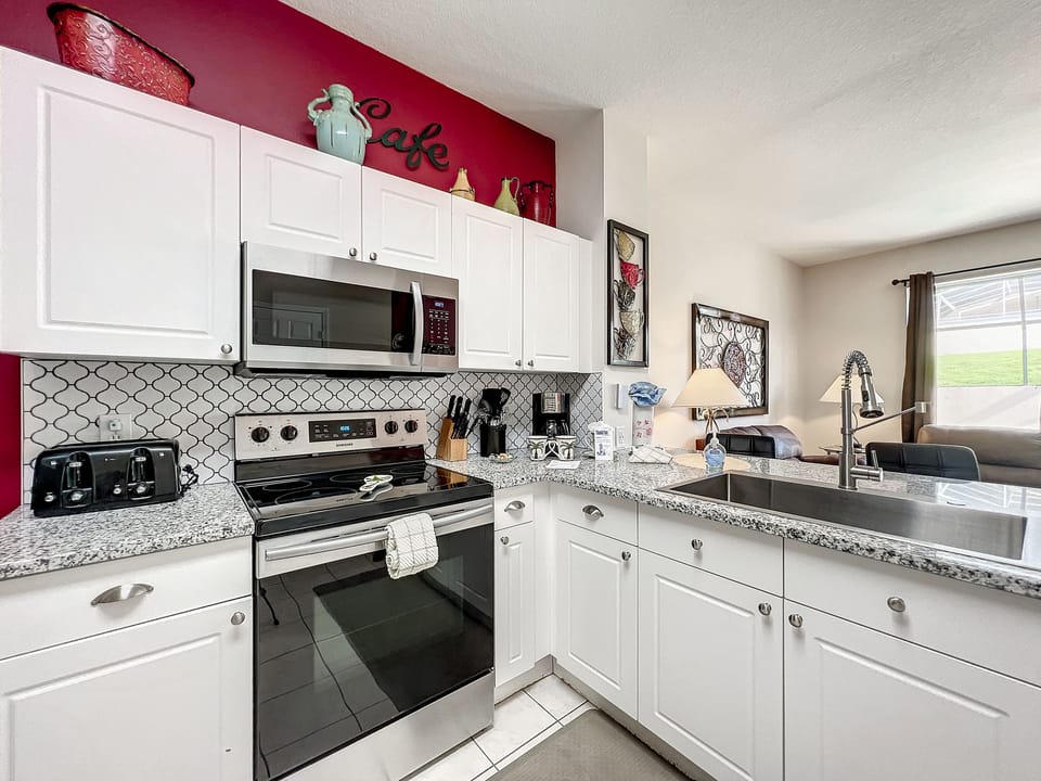 Bright kitchen with modern touches, perfect for preparing meals during your stay.