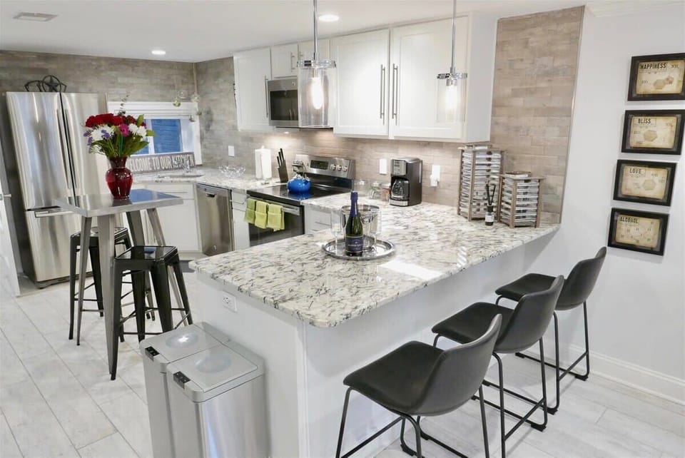 Kitchen island is great for unwinding together, snagging a meal, or getting some work done 