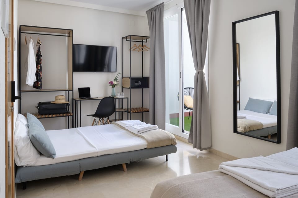 Quadruple Room, Balcony | Hypo-allergenic bedding, in-room safe, desk, blackout drapes