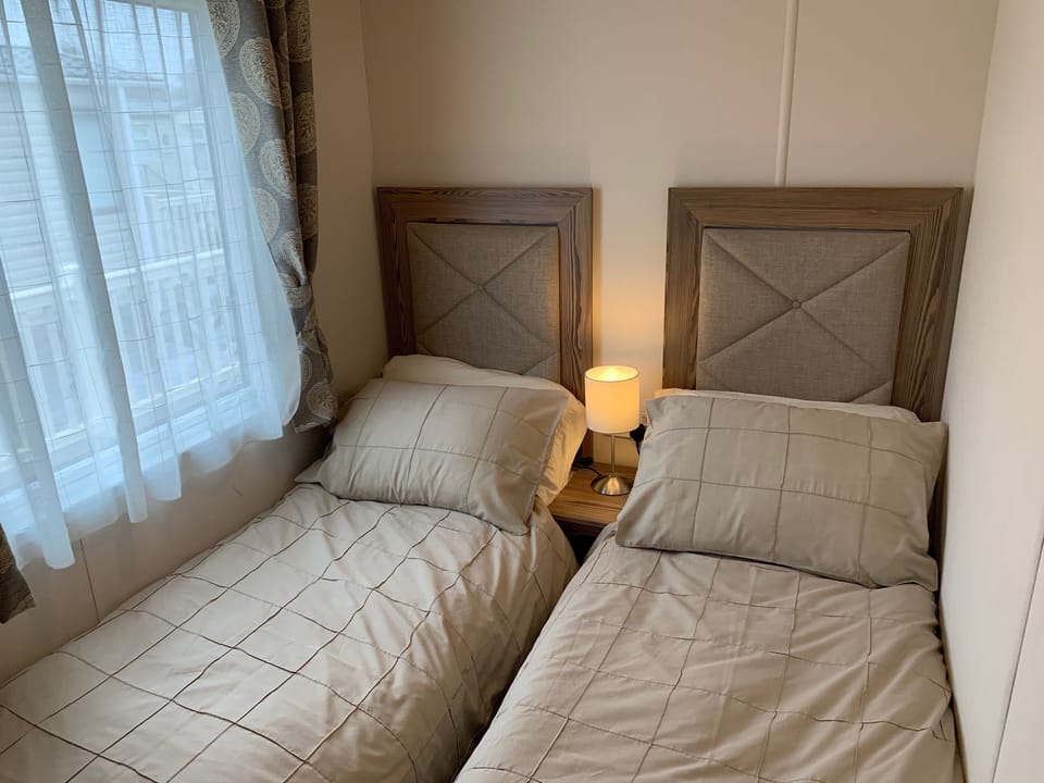 Twin Room with small single beds, wardrobe and mirror. USB Electrical Sockets
