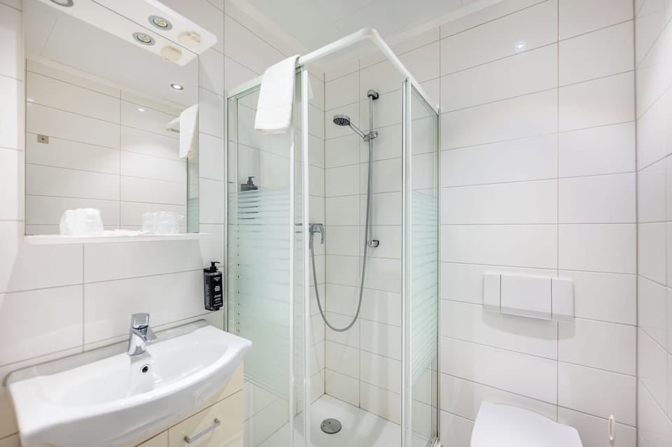 Double Room | Bathroom | Shower, hair dryer, towels, soap