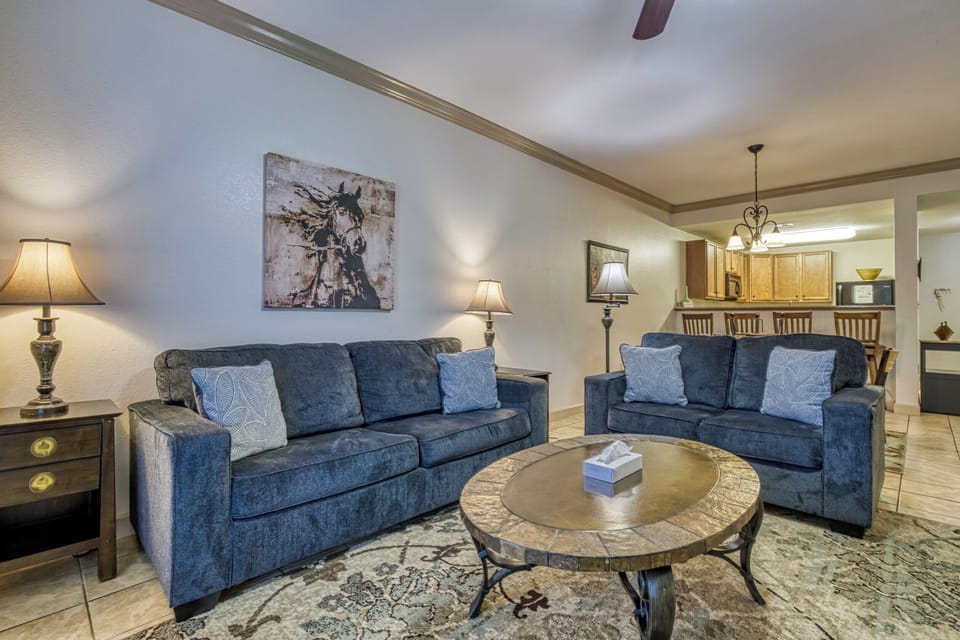 Living Room, Kitchen, Tile Floor, Couches, Table, Lamps, Pillows, Rug, Tile, Art