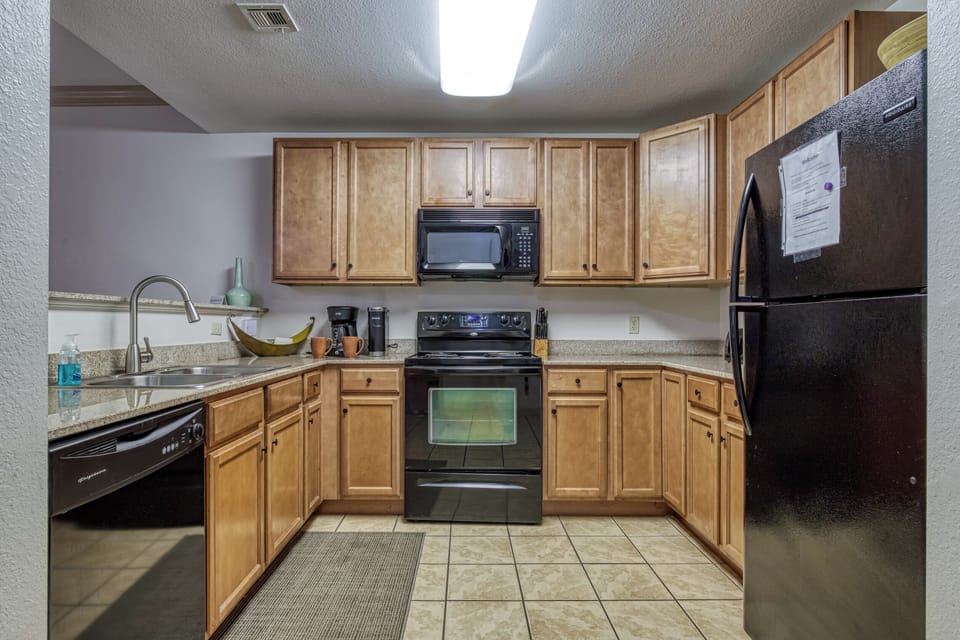 Kitchen, Stainless Sink, Wood Cabinets, Tile Floor, Coffee, Keurig, Knives, Cups