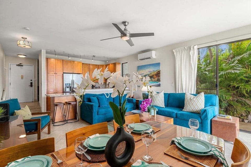 Another angle carries the same flow, recessed lights and ceiling fans balancing brightness with calm.