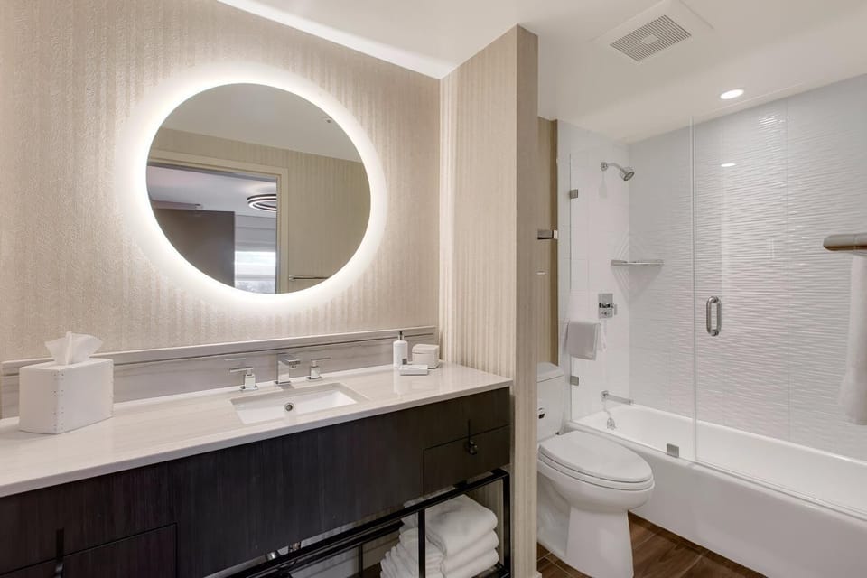Combined shower/tub, designer toiletries, hair dryer, bathrobes