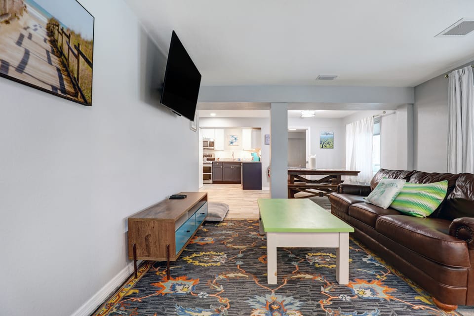 Living room with leather couches and 55" T.V.